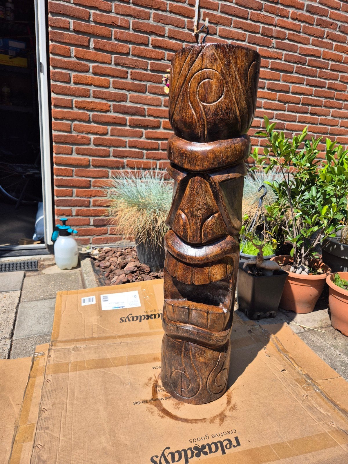 Houten totem, Ophalen