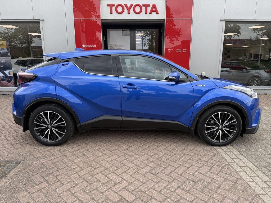 Toyota C-HR 1.8 Hybrid Style Premium Pack, Auto's, Euro 6, 4 cilinders, Blauw, Leder en Stof