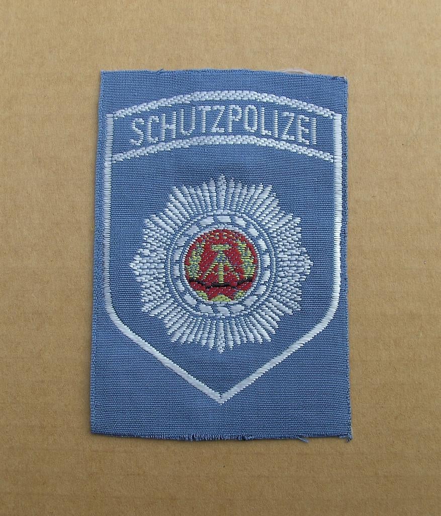DDR / NVA  embleem Schutzpolizei, Verzamelen, Militaria | Algemeen, Ophalen of Verzenden, Landmacht, Duitsland, Embleem of Badge