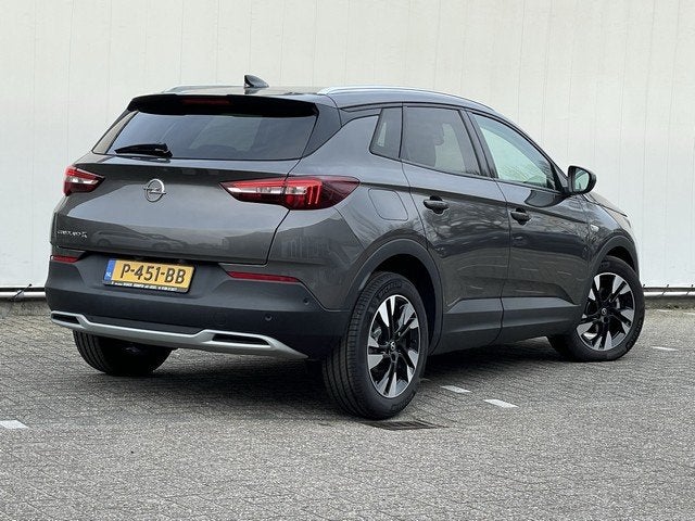 Opel Grandland X 1.2 Turbo Elegance Automaat met Navi/Camera, Auto's, Opel, 12 maanden, Gebruikt, 1199 cc, Leder en Stof