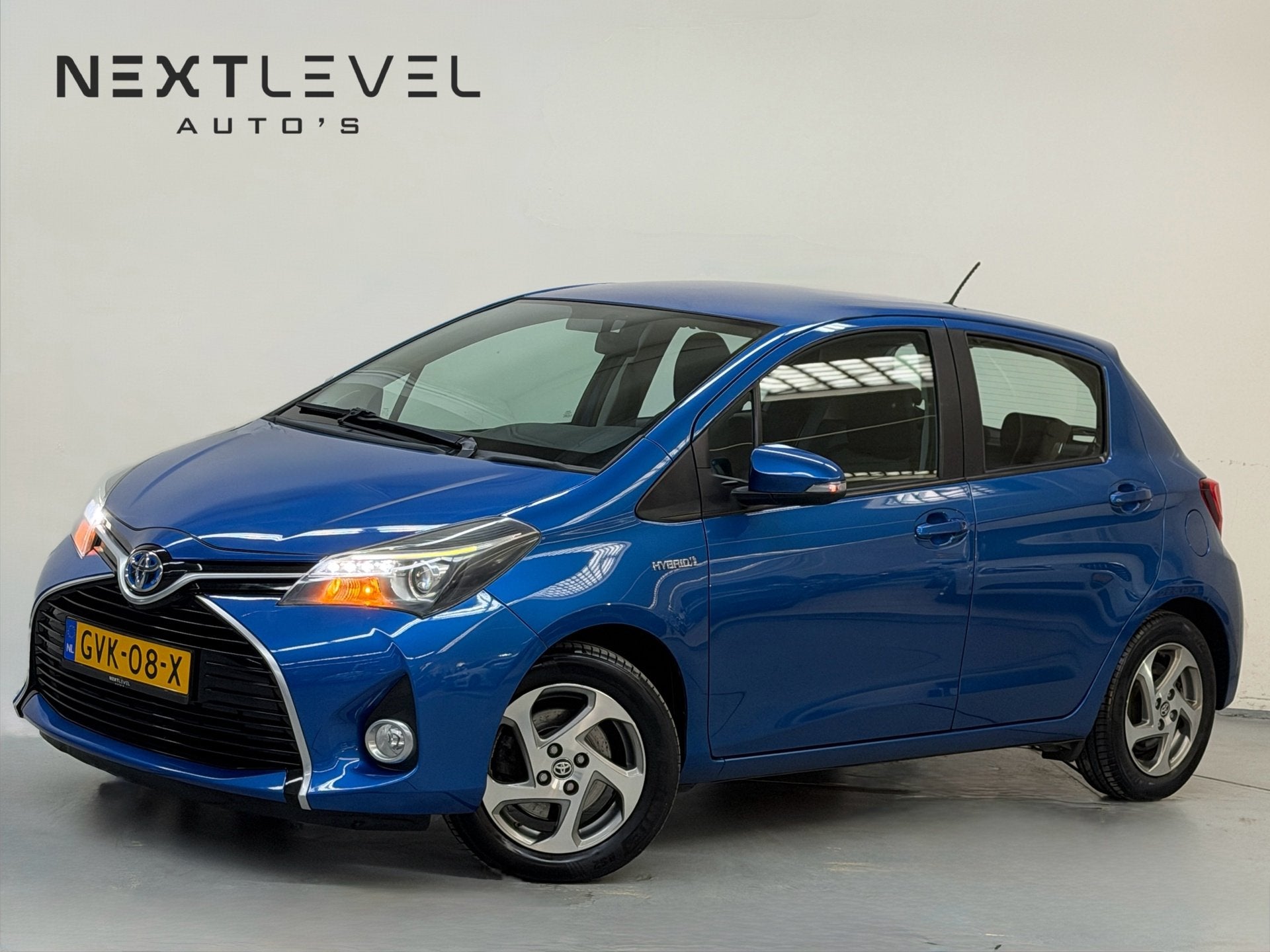 Toyota Yaris 1.5 Hybrid Aspiration Achteruitrijcamera Cruise, Auto's, Dealer onderhouden, Gebruikt, 4 cilinders, Blauw