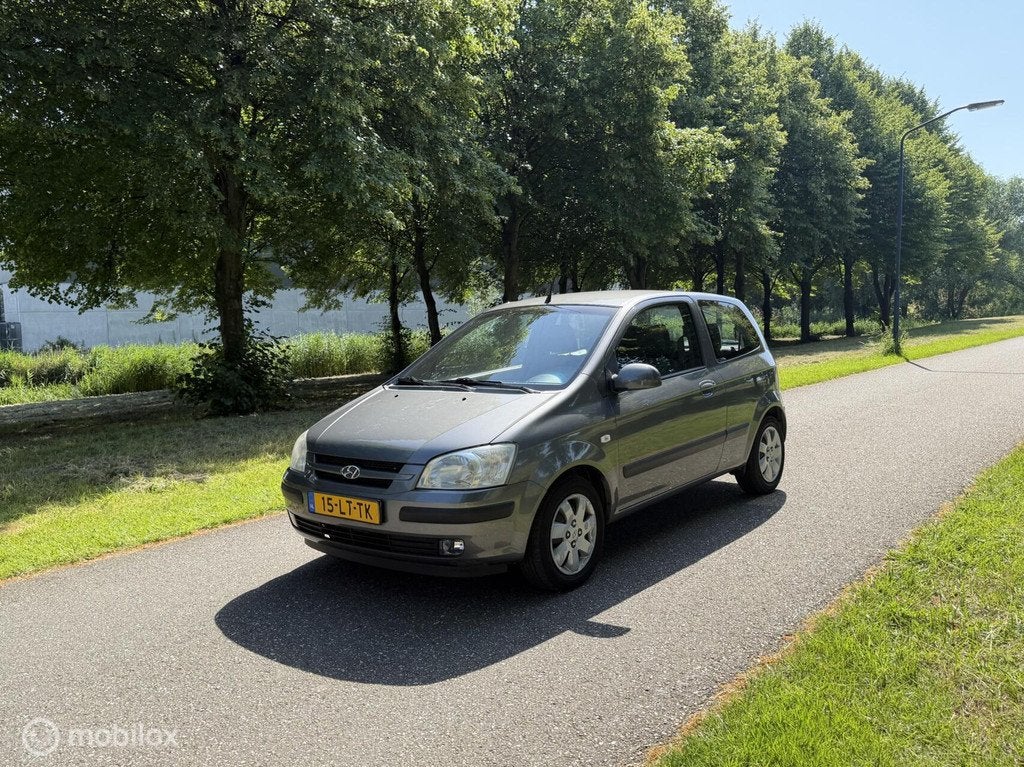 Hyundai Getz 1.3i GLS*NEW APK*AUTOMAAT*NAP*AIRCO*ELEK.RAMEN, Auto's, Hyundai, 4 cilinders, 82 pk, Bedrijf, Grijs