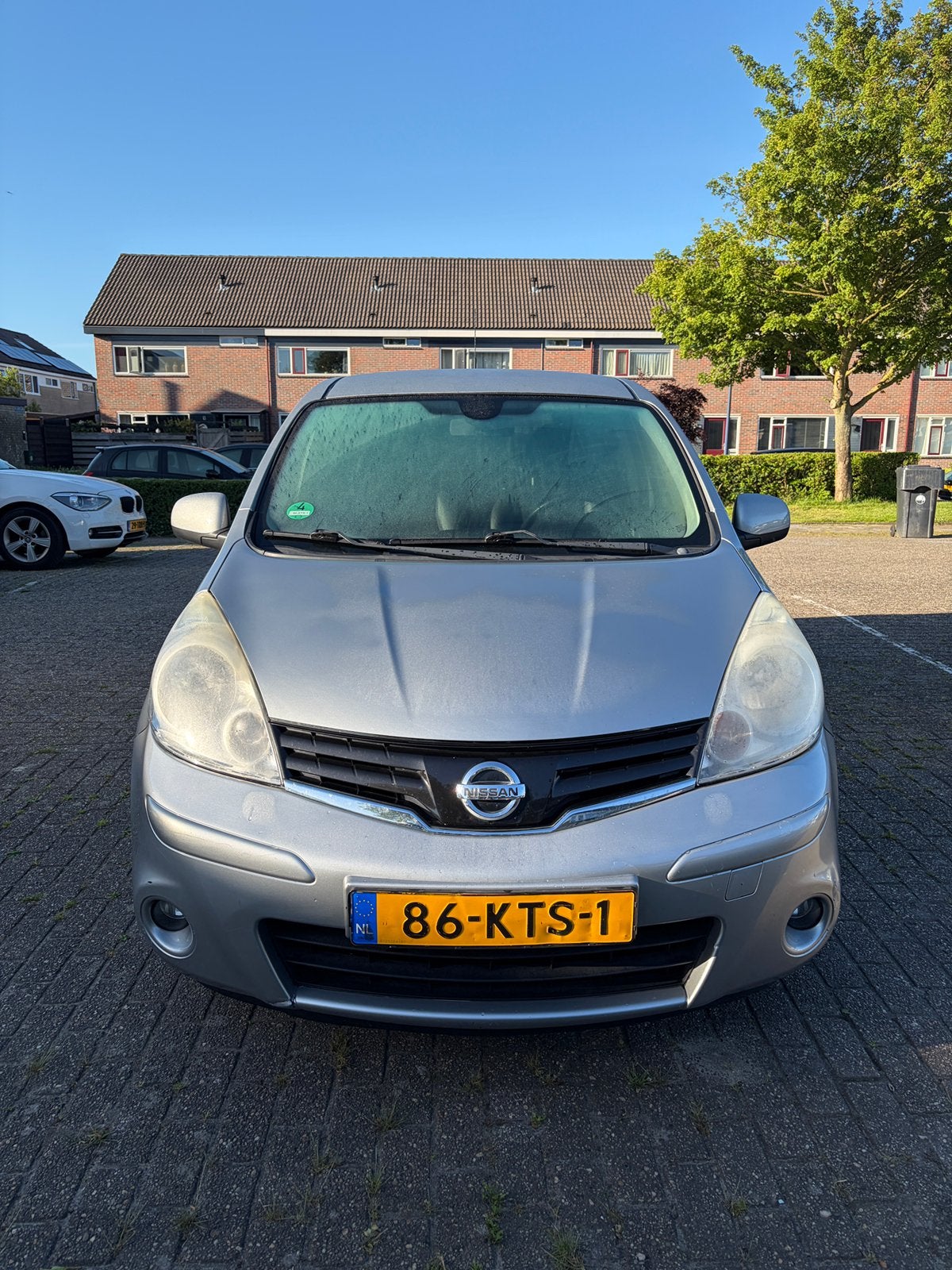 Nissan Note 1.6 16V AUT 2010 Grijs, Auto's, Nissan, 15 km/l, 4 cilinders, Leder en Stof, Origineel Nederlands