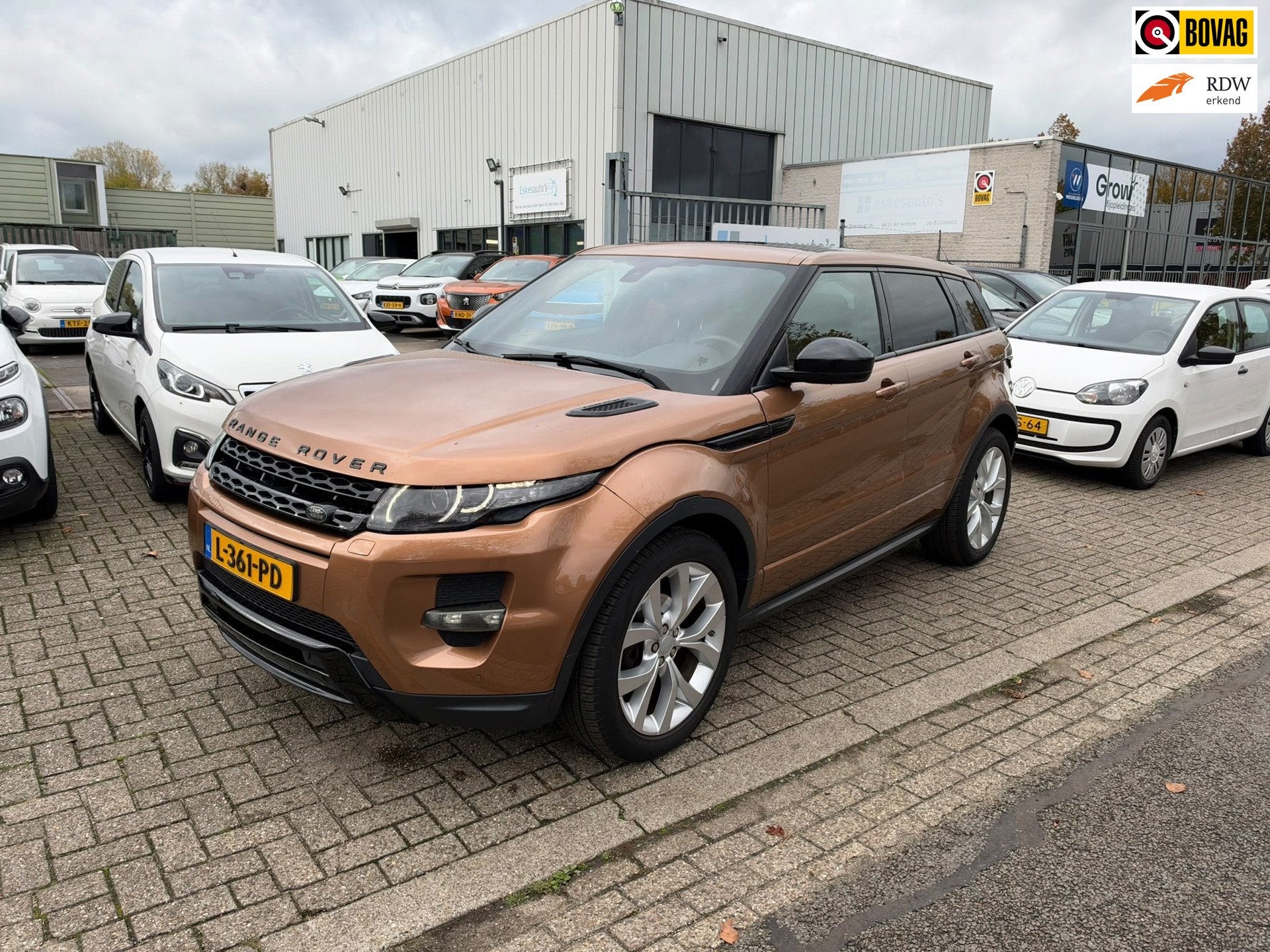 Land Rover Range Rover Evoque 2.0 Si 4WD Prestige Automaat,, Zwart, 4 cilinders, Bruin, Leder