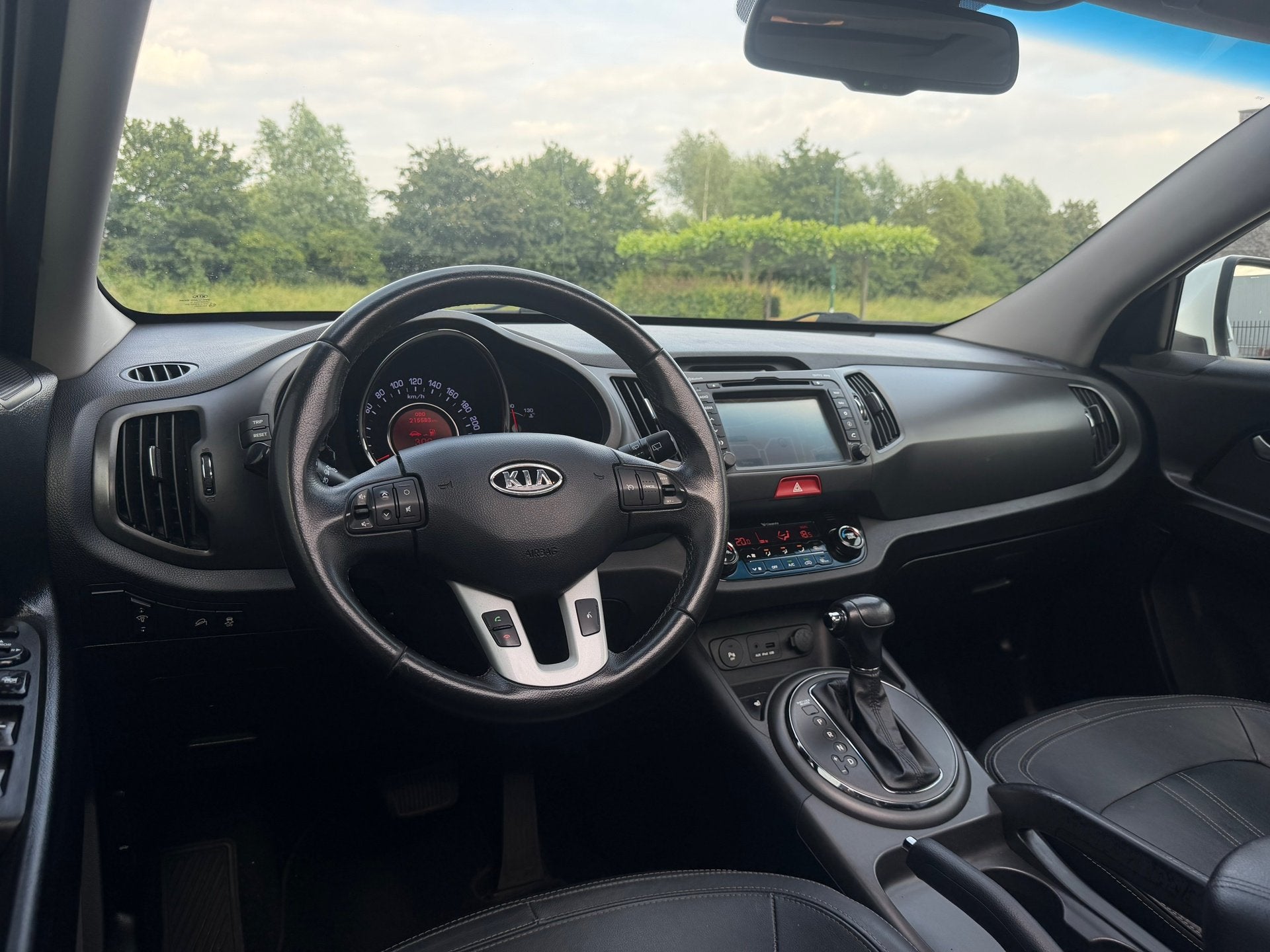 Kia Sportage 2.0 X-clusive Automaat|Navi|Pano|Keyless|Trekha, Auto's, Gebruikt, Zwart, 4 cilinders, 1600 kg