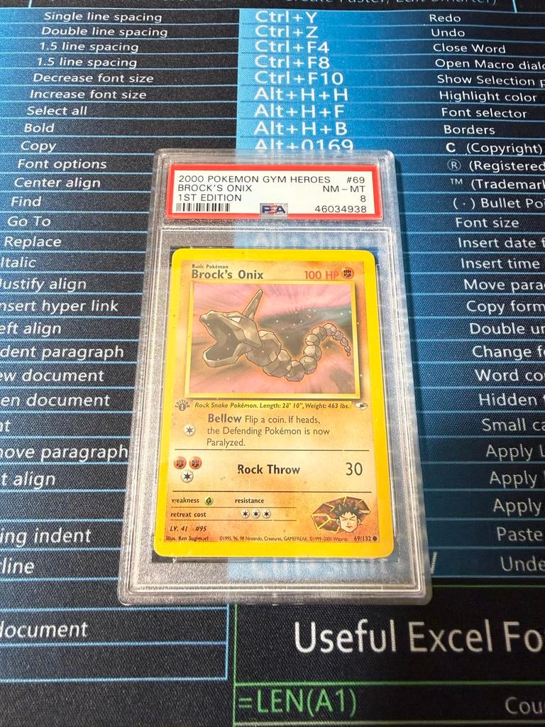 Brock's Onix Pokémon 1st edition PSA 8, Ophalen of Verzenden, Zo goed als nieuw, Losse kaart