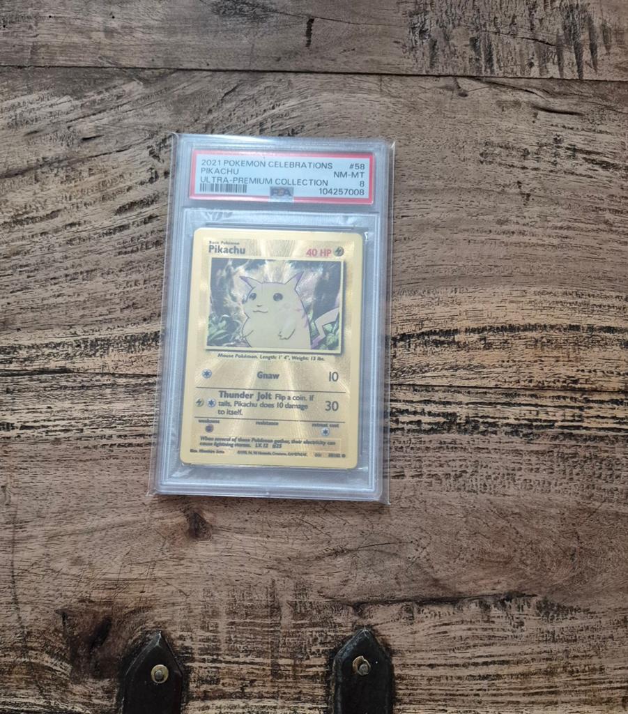 Pikachu UPC Metal Promo Celebrations PSA8, Ophalen of Verzenden