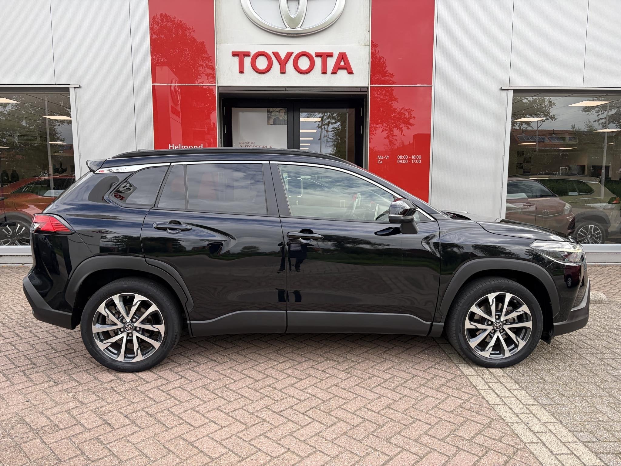 Toyota Corolla Cross 2.0 High Power Hybrid First Edition, Auto's, Gebruikt, 4 cilinders, Leder en Stof, Zwart
