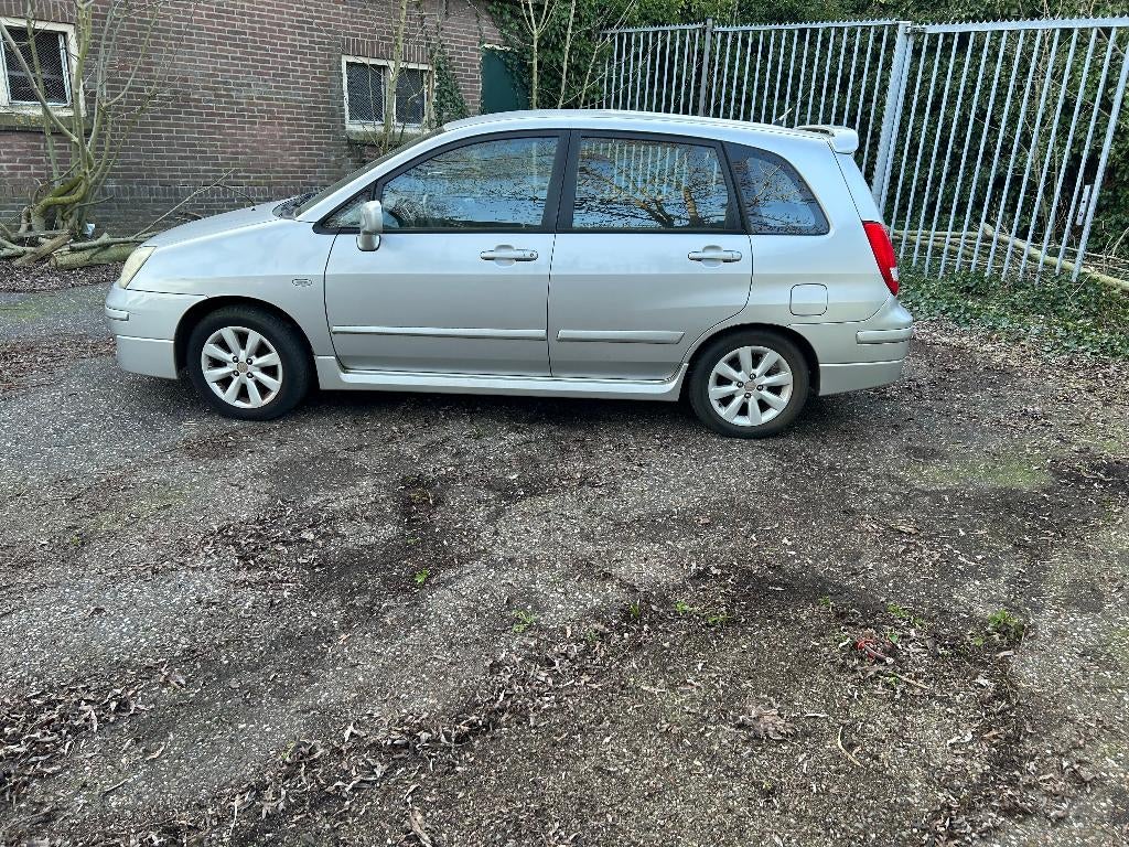 SUZUKI  LAINA 1.6  airco en pak  - 3 - 2026 NIEUW APK BIJ, Auto's, Voorwielaandrijving, Stof, 4 cilinders, Blauw