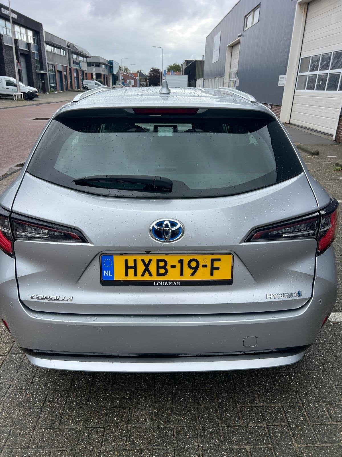 Toyota Corolla TS 1.8 Hybrid 122pk CVT 2022 Grijs, Auto's, 4 cilinders, Verwarmde buitenspiegels, 98 pk, Stationwagon