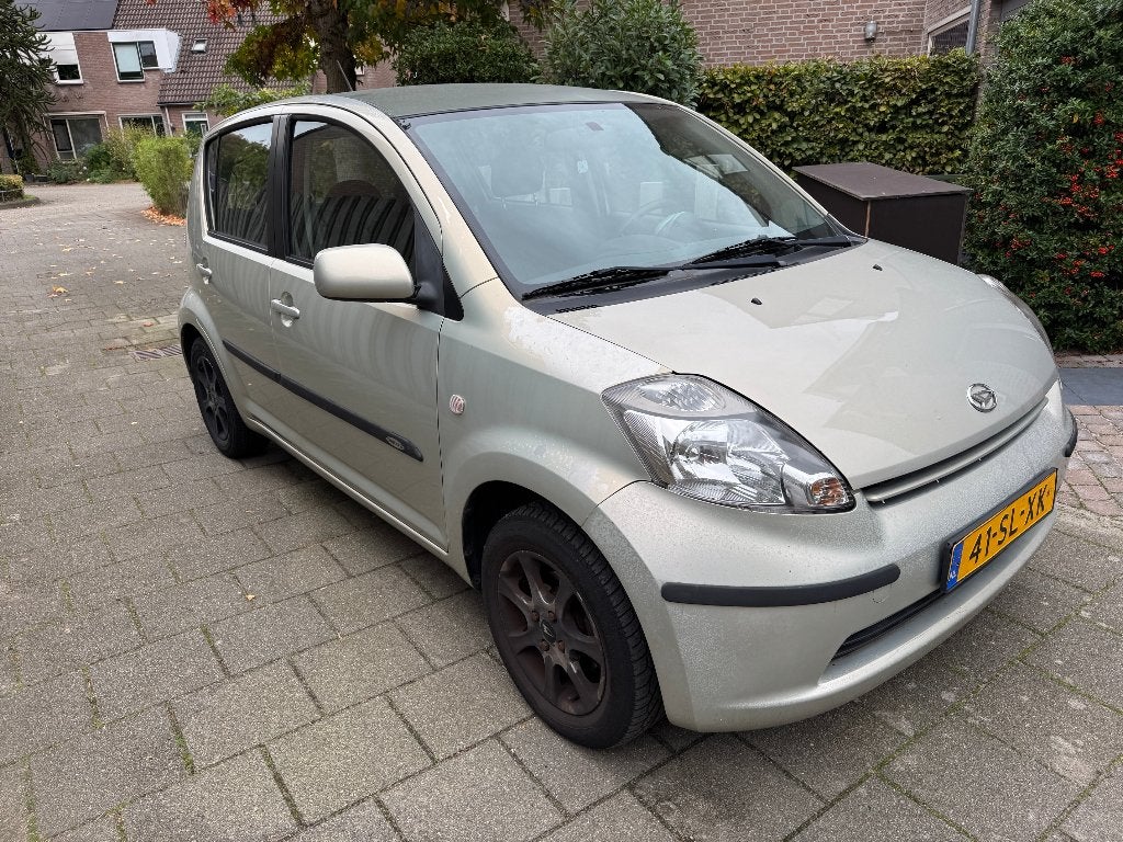 Daihatsu Sirion 1.3 2006 Beige, Auto's, Stof, 4 cilinders, Beige, Handgeschakeld