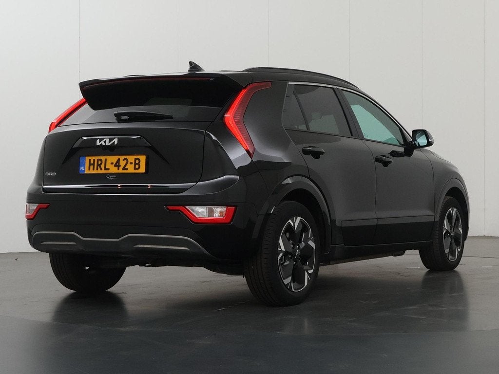Kia Niro EV Light Advanced 64.8 kWh | Stoel verwarming | App, Auto's, Kia, Gebruikt, 750 kg, 1657 kg, Leder en Stof