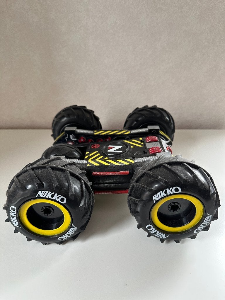 Nikko Slammr / flip car / auto, radiografisch bestuurbaar., Ophalen of Verzenden, Gebruikt, Afstandsbediening