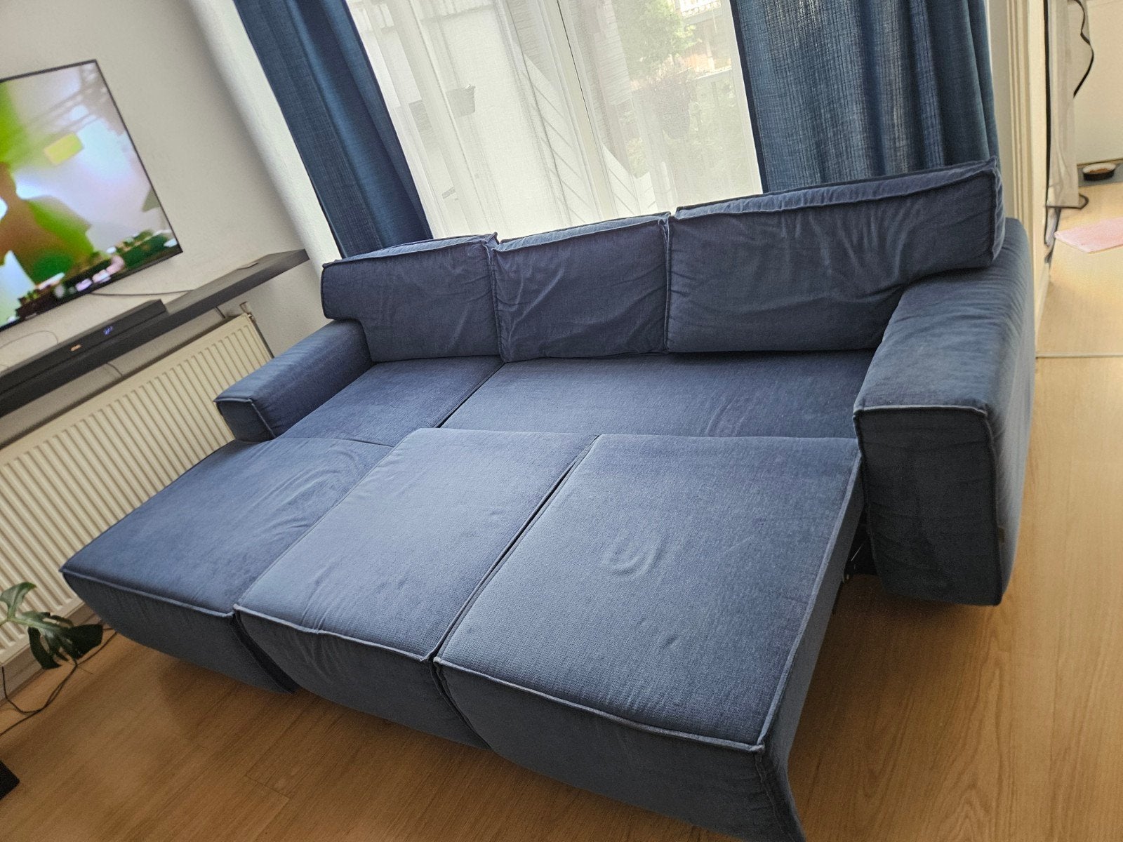 Comfortabele blauwe hoekbank met uitschuifbaar gedeelte, Ophalen, 250 tot 300 cm, Gebruikt, 100 tot 125 cm