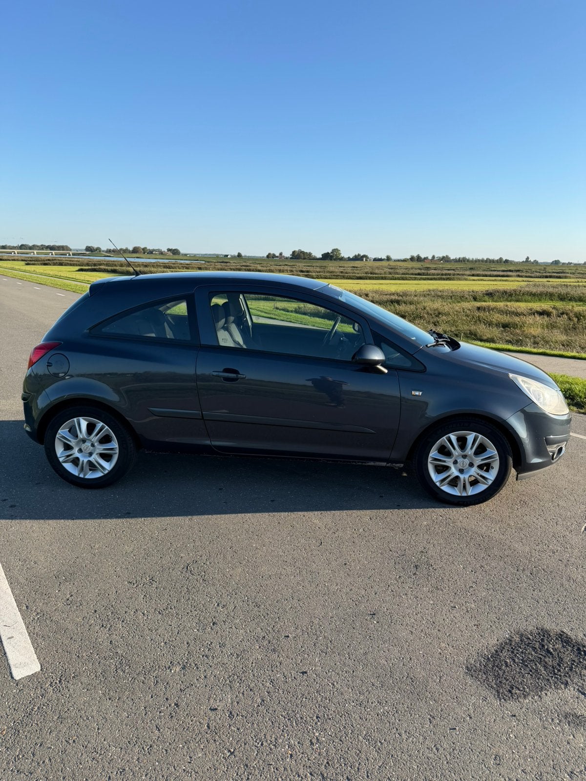 Opel Corsa D 1.2 Benzine – 2006 – 299.960 km, Voorwielaandrijving, 40 €/maand, Zwart, 4 cilinders