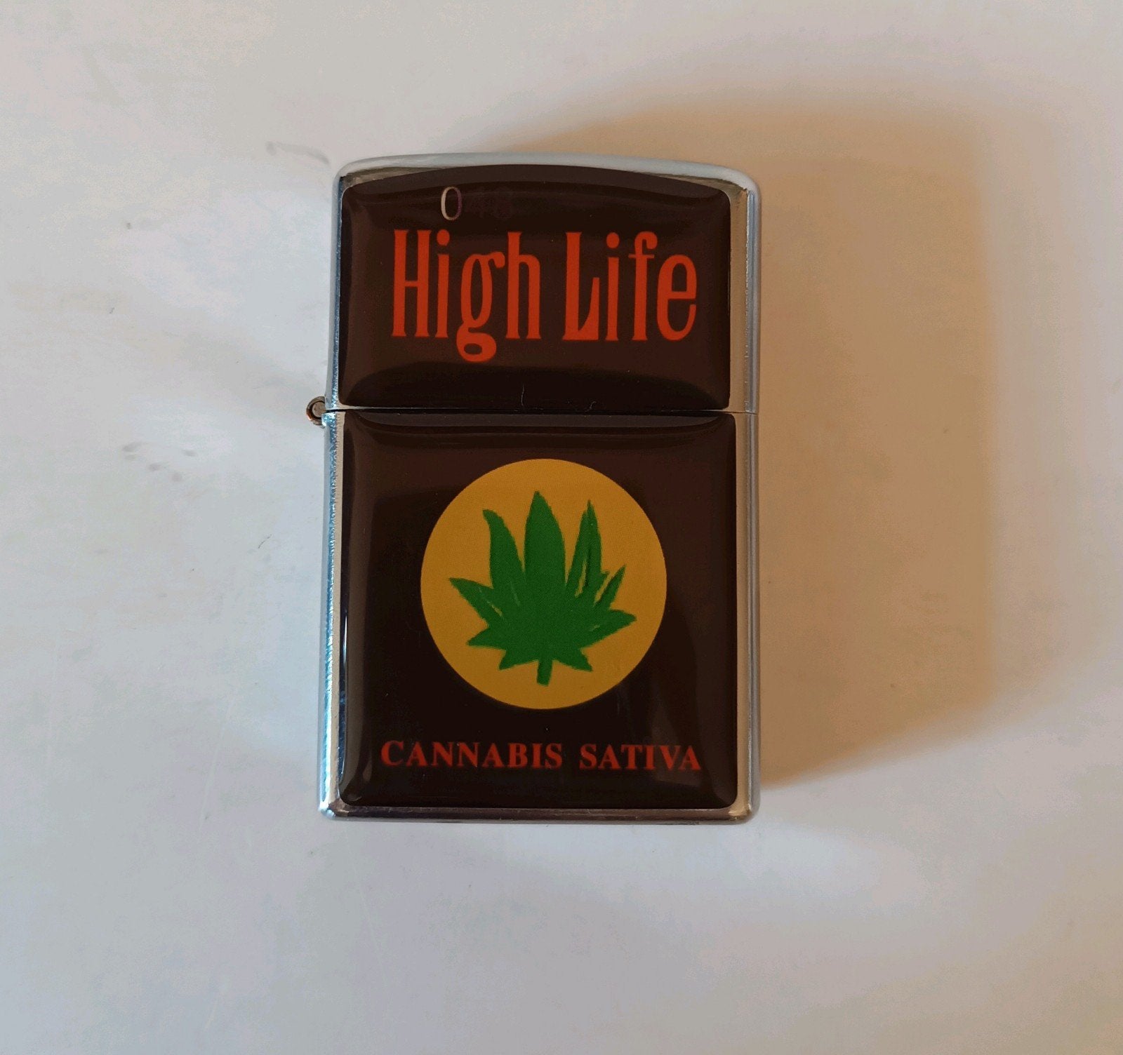 High Life Zippo aansteker - Cannabis Sativa design, Ophalen of Verzenden, Zo goed als nieuw, Aansteker