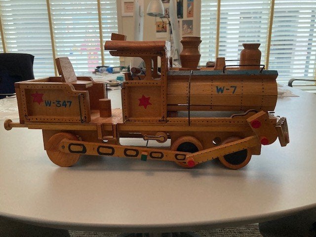 Houten modeltrein locomotief W-7, Ophalen