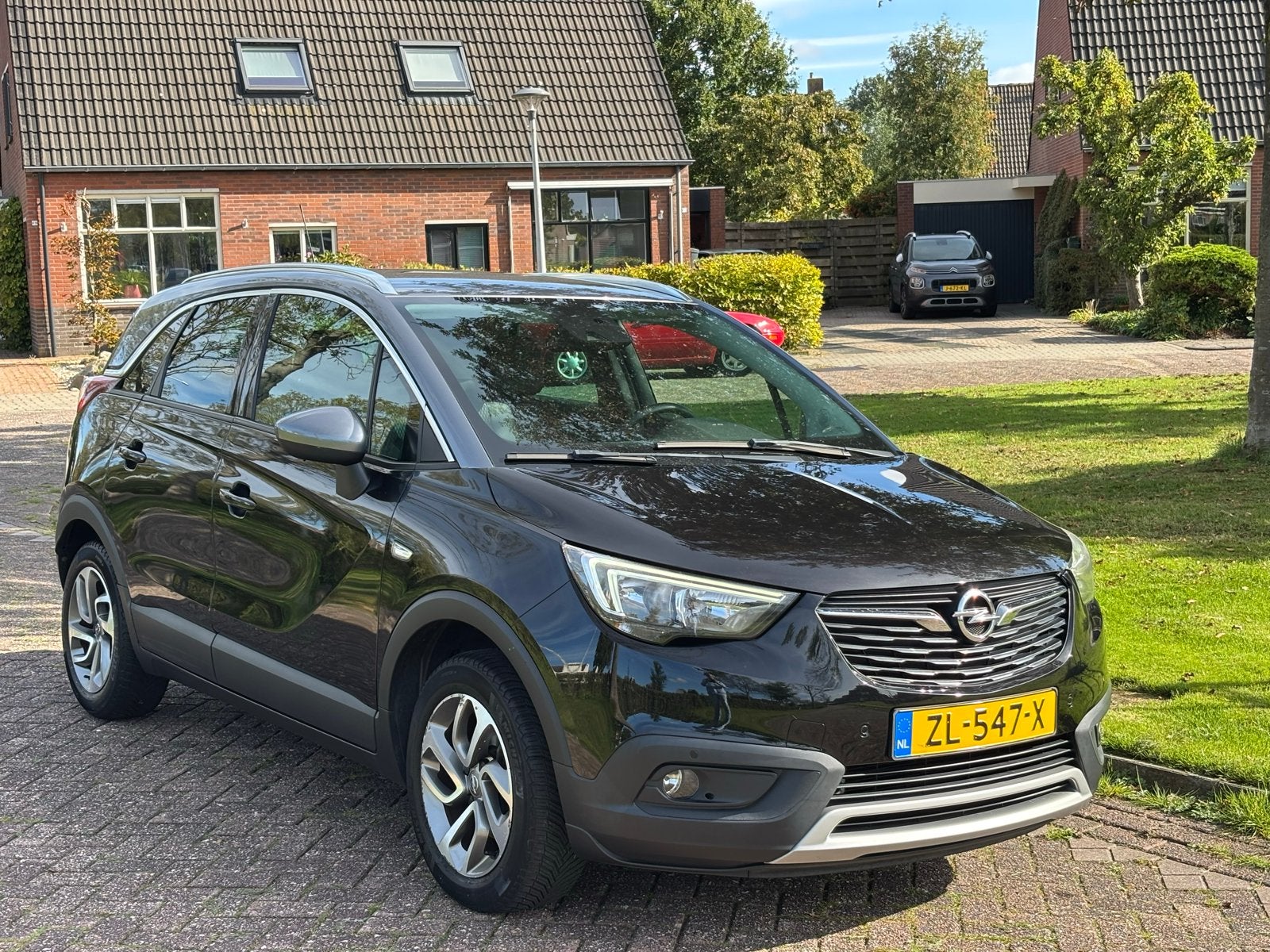 Opel Crossland X 1.2 Turbo 110pk Automaat, Auto's, Dealer onderhouden, 840 kg, Zwart, Leder en Stof