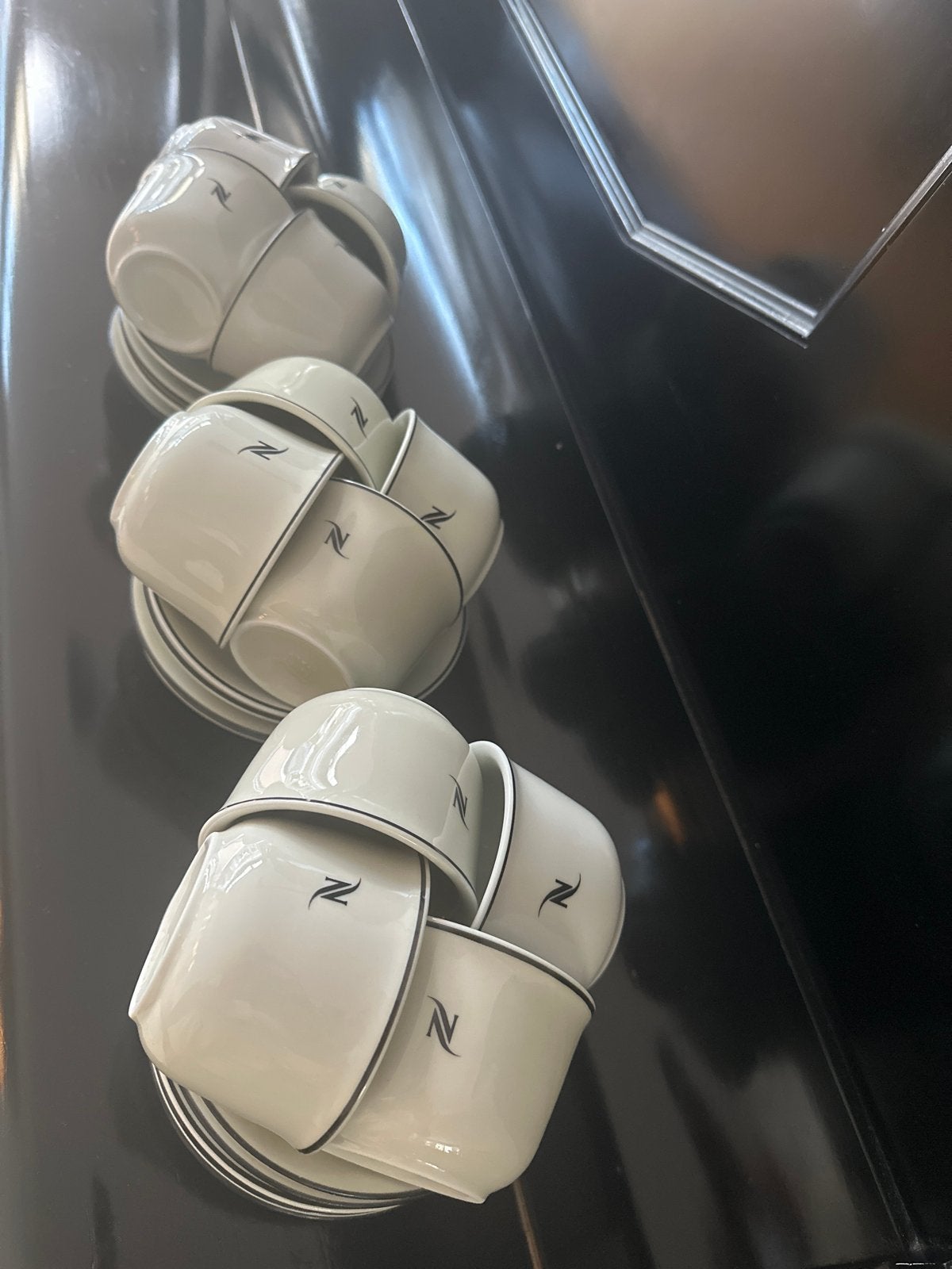 Nespresso koffiekopjes met schotels - Set van 12, Overige merken, Ophalen of Verzenden, Zo goed als nieuw, Modern