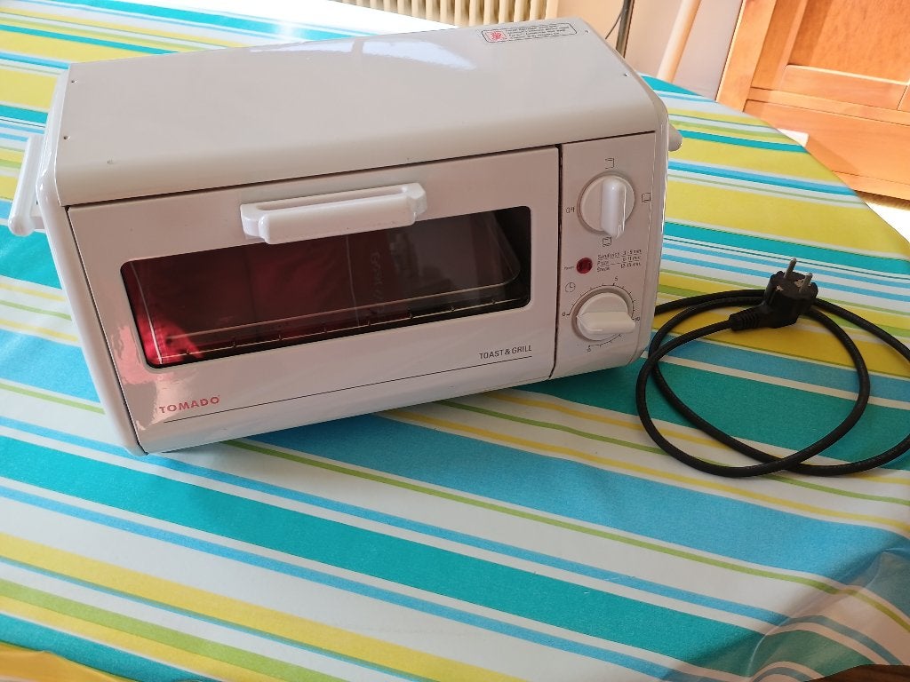 Tomado Toast and Grill oven, Minder dan 45 cm, Ophalen of Verzenden, Vrijstaand, Gebruikt