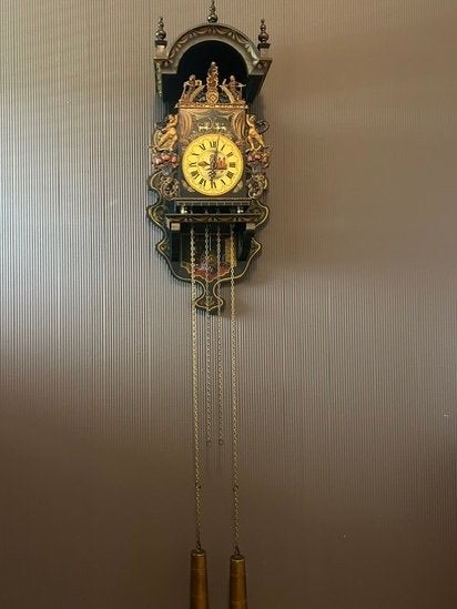Mooie bakkers wandklok, Ophalen
