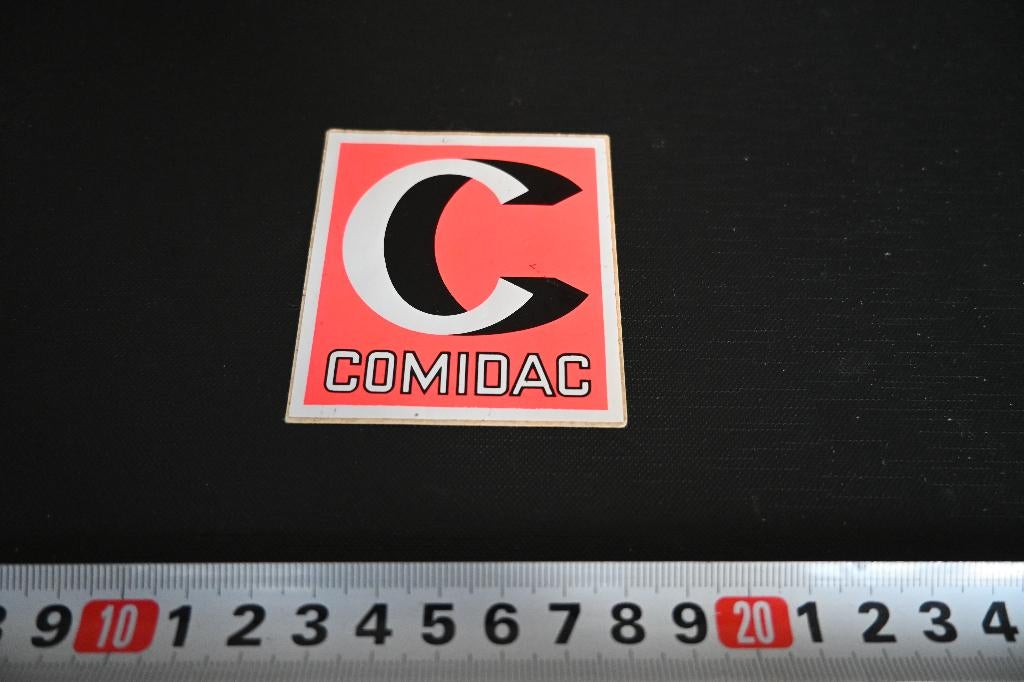 sticker COMIDAC, Verzamelen, Stickers, Zo goed als nieuw, Ophalen