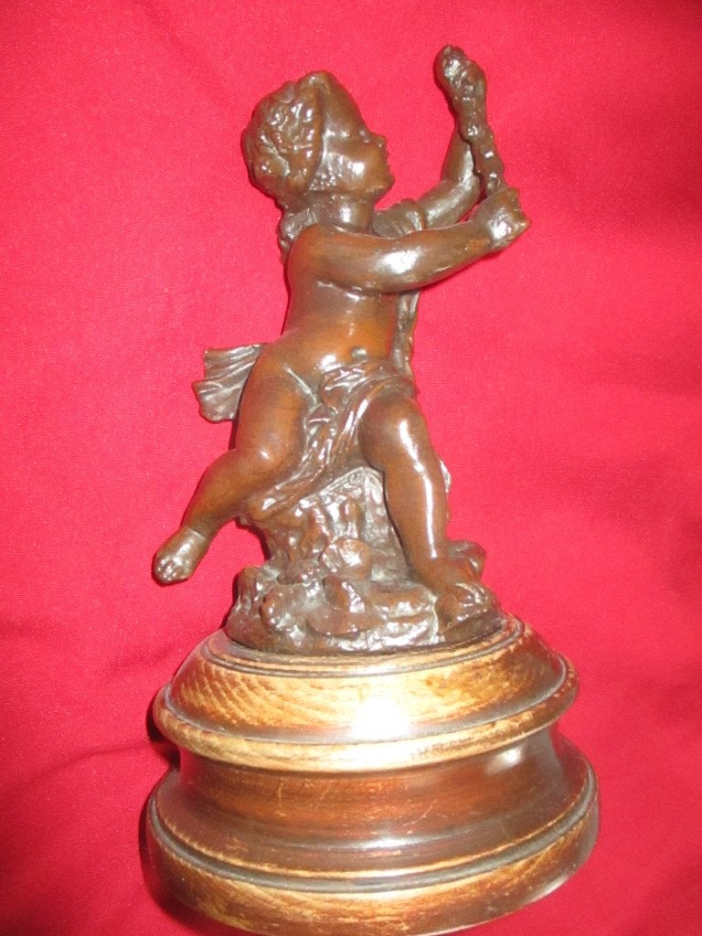 Een Antieke Engel op houten voet hoog 26 cm ., Ophalen of Verzenden