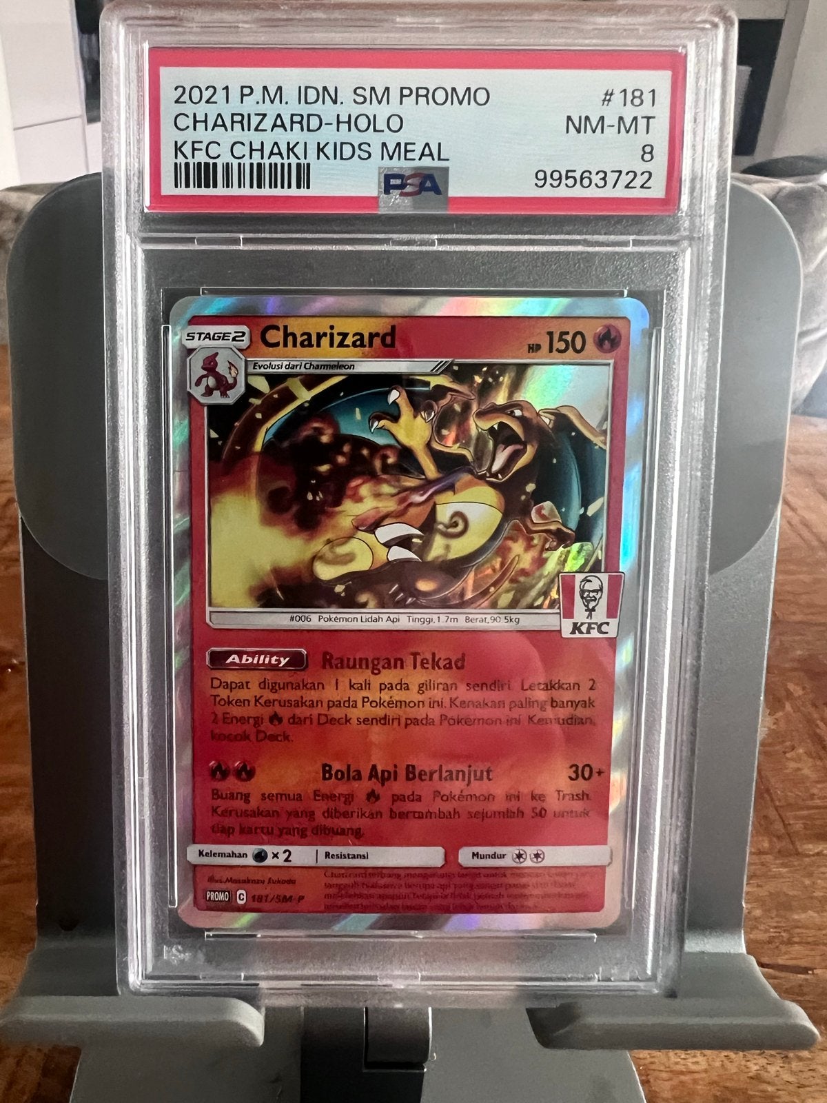 Pokemon Charizard 181/SM-P KFC Promo Kaart PSA 8, Ophalen of Verzenden, Zo goed als nieuw, Losse kaart