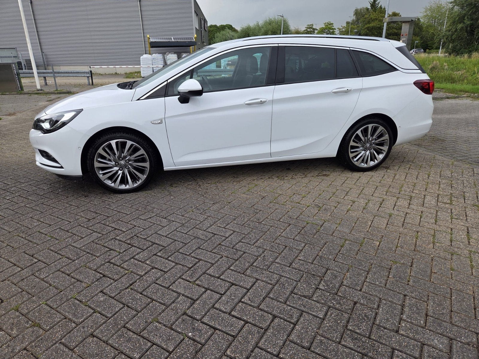 Opel Astra 1.4 Turbo, Auto's, Opel, 4 cilinders, Wit, Origineel Nederlands, Stationwagon