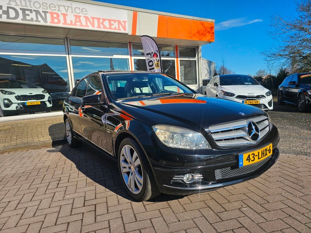 Mercedes-Benz C-klasse 180 K BlueEFFICIENCY Bns Edition Avan, Auto's, Mercedes-Benz, Gebruikt, Leder en Stof, Zwart, Handgeschakeld