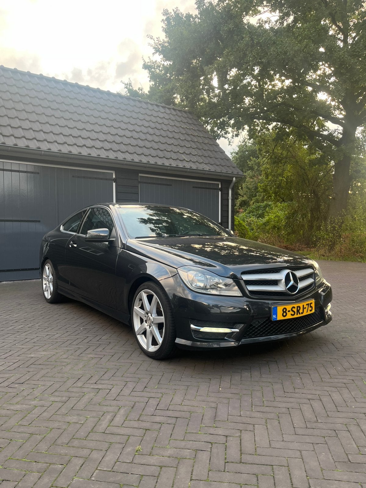 Mercedes-Benz C-Klasse C180 Coupe Aut7 2013 Zwart, Auto's, Automaat, Achterwielaandrijving, 1800 kg, Zwart