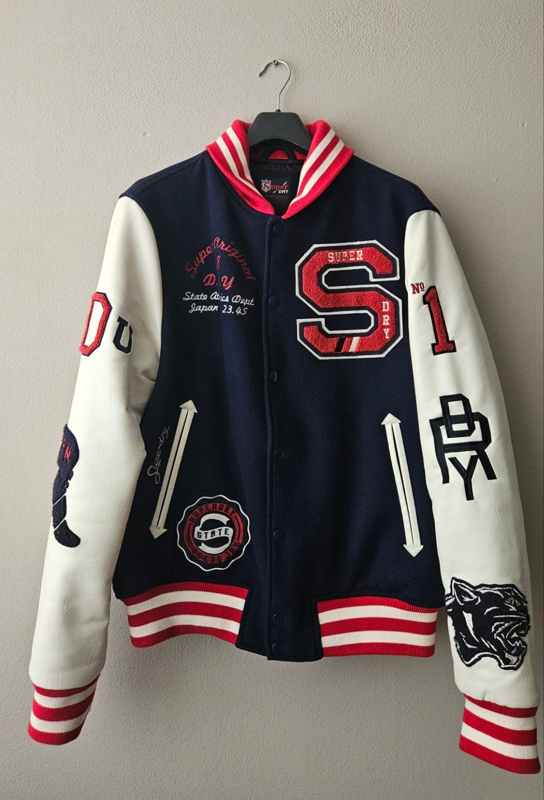 Superdry Varsity Jacket Maat L - Zo goed als nieuw, Maat 52/54 (L), Blauw, Ophalen of Verzenden, Zo goed als nieuw