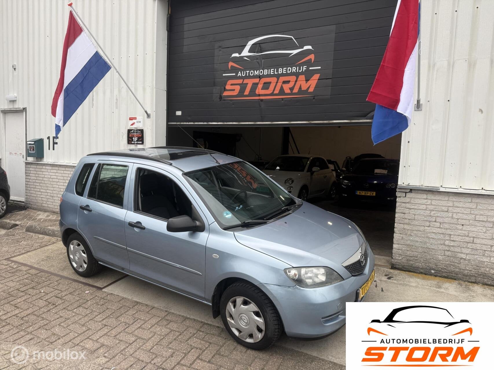 Mazda 2 1.4 Exclusive, Auto's, 15 km/l, 4 cilinders, Blauw, Bedrijf