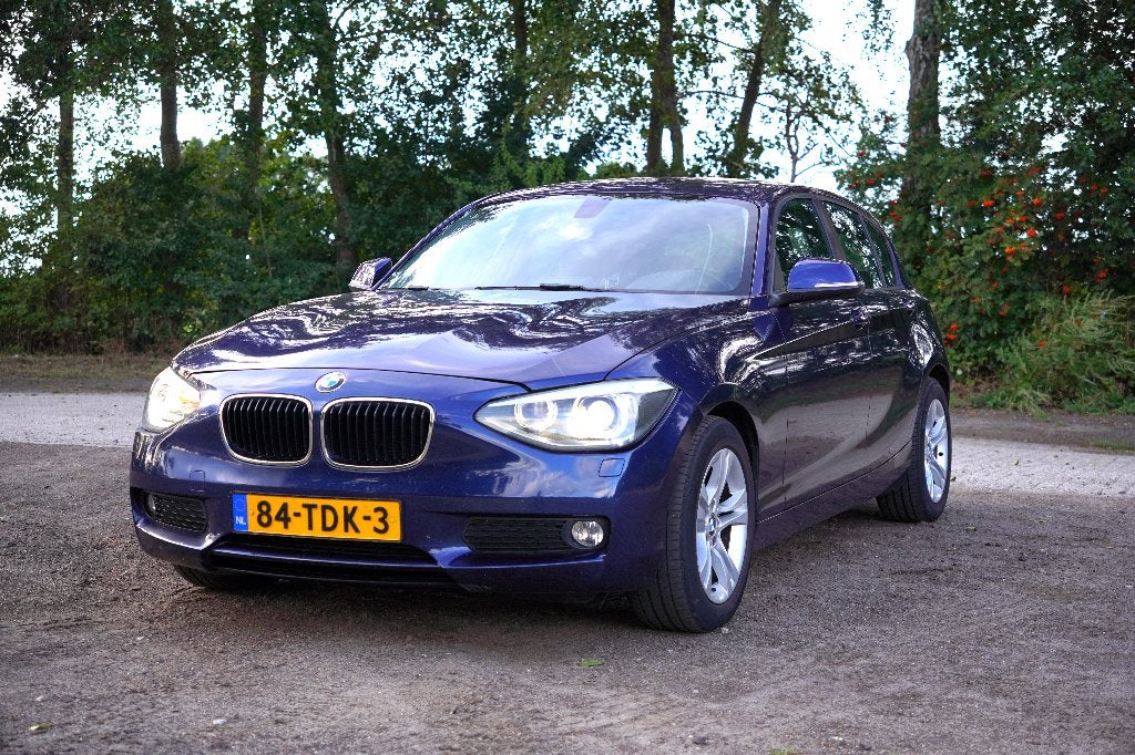 BMW 1-Serie 116i 136pk 5DR 2012 Blauw - Trekhaak, Xenon, Auto's, 1-Serie, Euro 5, Zwart, 4 cilinders