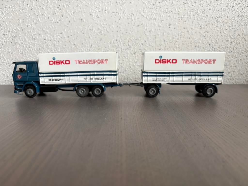 Tekno Holland 1/50 Scania 142H V8 Disko Transport De Lier, Hobby en Vrije tijd, Modelauto's | 1:50, Ophalen of Verzenden, Zo goed als nieuw