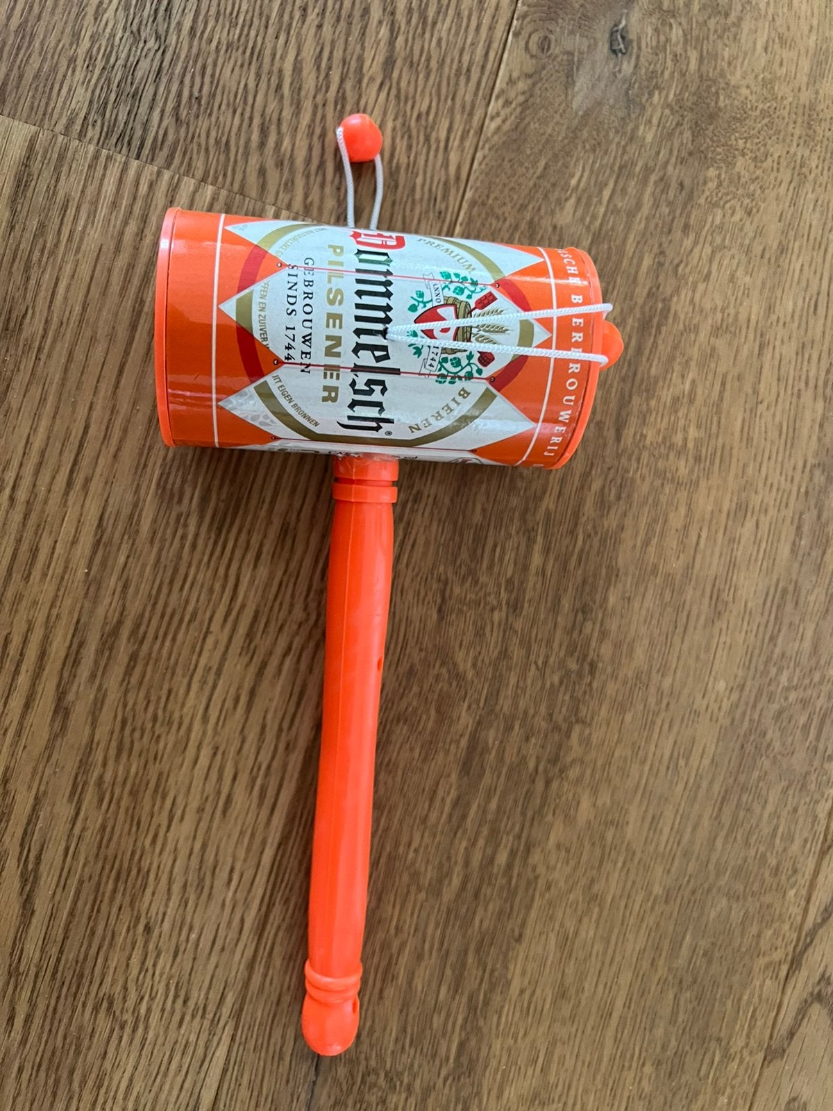 Dommelsch plastic oranje draaitrommel, Ophalen of Verzenden, Gebruikt, Feestartikel, Oranje of Koningsdag