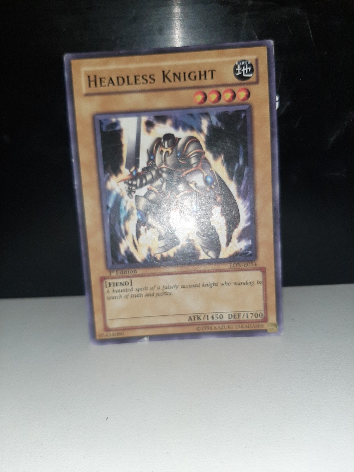 Yu-Gi-Oh! Headless Knight 1st Edition LON-E054, Ophalen of Verzenden, Gebruikt, Losse kaart