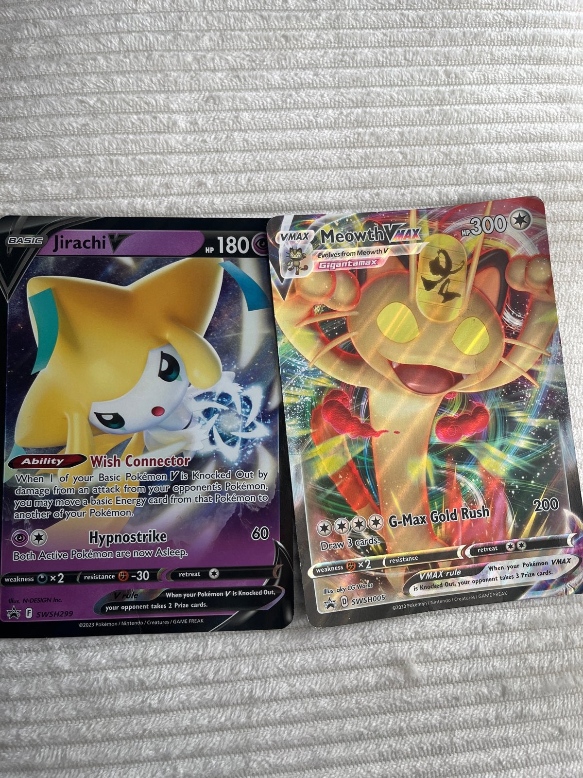 2 Mega Pokémon kaarten (Jirachi V & Meowth VMAX), Ophalen, Zo goed als nieuw, Meerdere kaarten