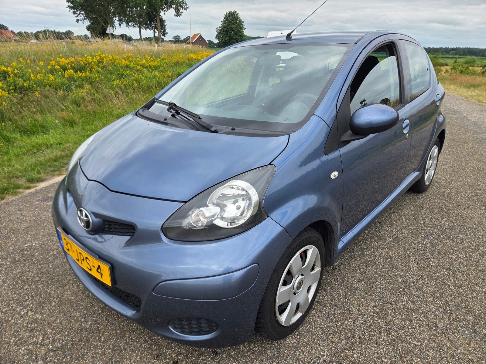 Toyota Aygo 1.0 12V Vvt-i 5DRS 2009 Blauw, Auto's, Voorwielaandrijving, Stof, Zwart, Metallic lak