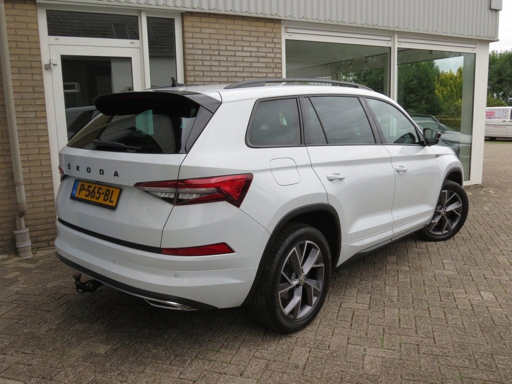 Skoda Kodiaq 1.5 TSI DSG Sportline Business Camera|Trekhaak|, Auto's, Skoda, 4 cilinders, 150 pk, Wit, Origineel Nederlands