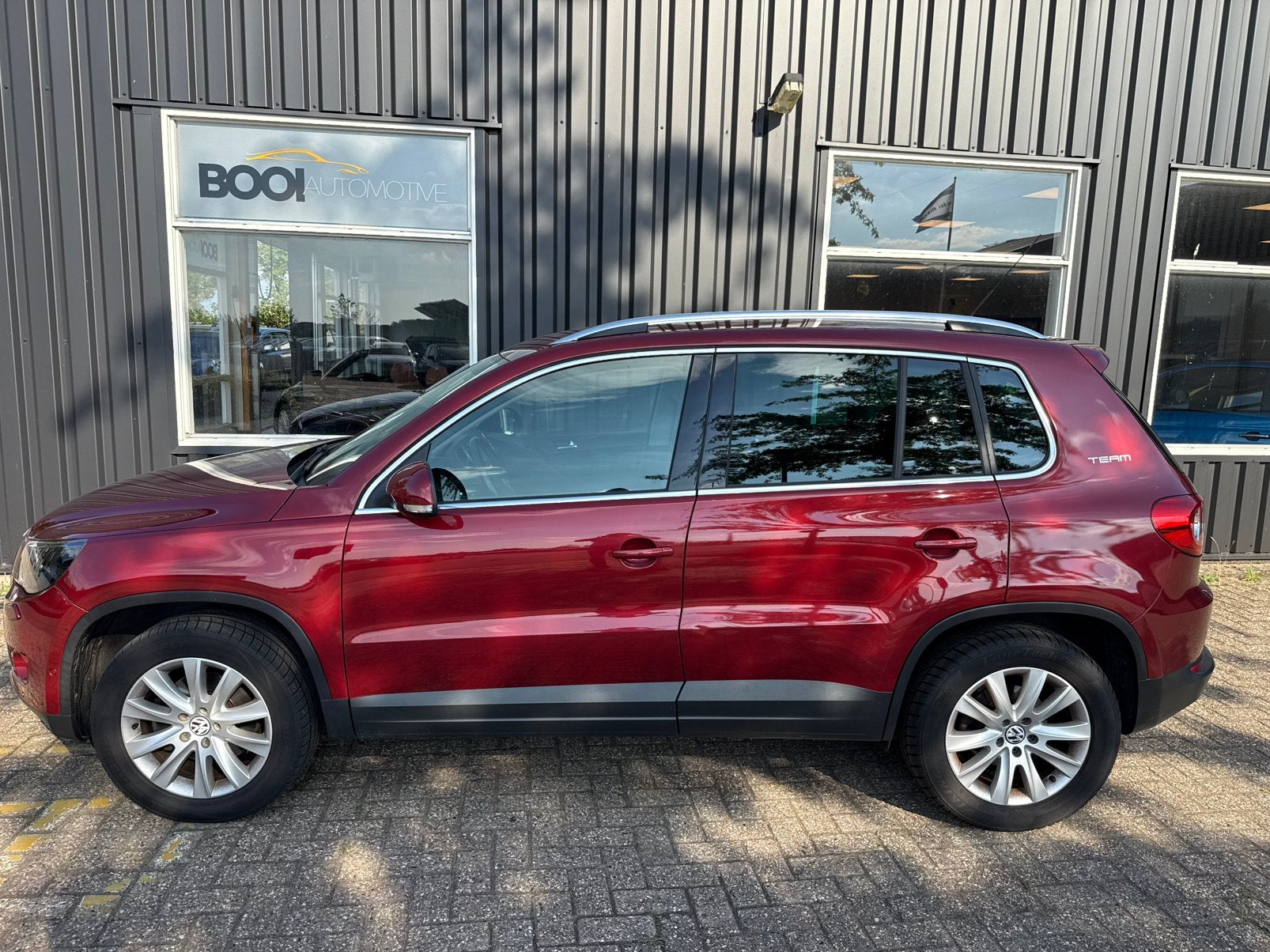Volkswagen Tiguan 1.4 TSI 110KW 4MOTION  TEAM Trekhaak, 13 km/l, Stof, Zwart, 4 cilinders