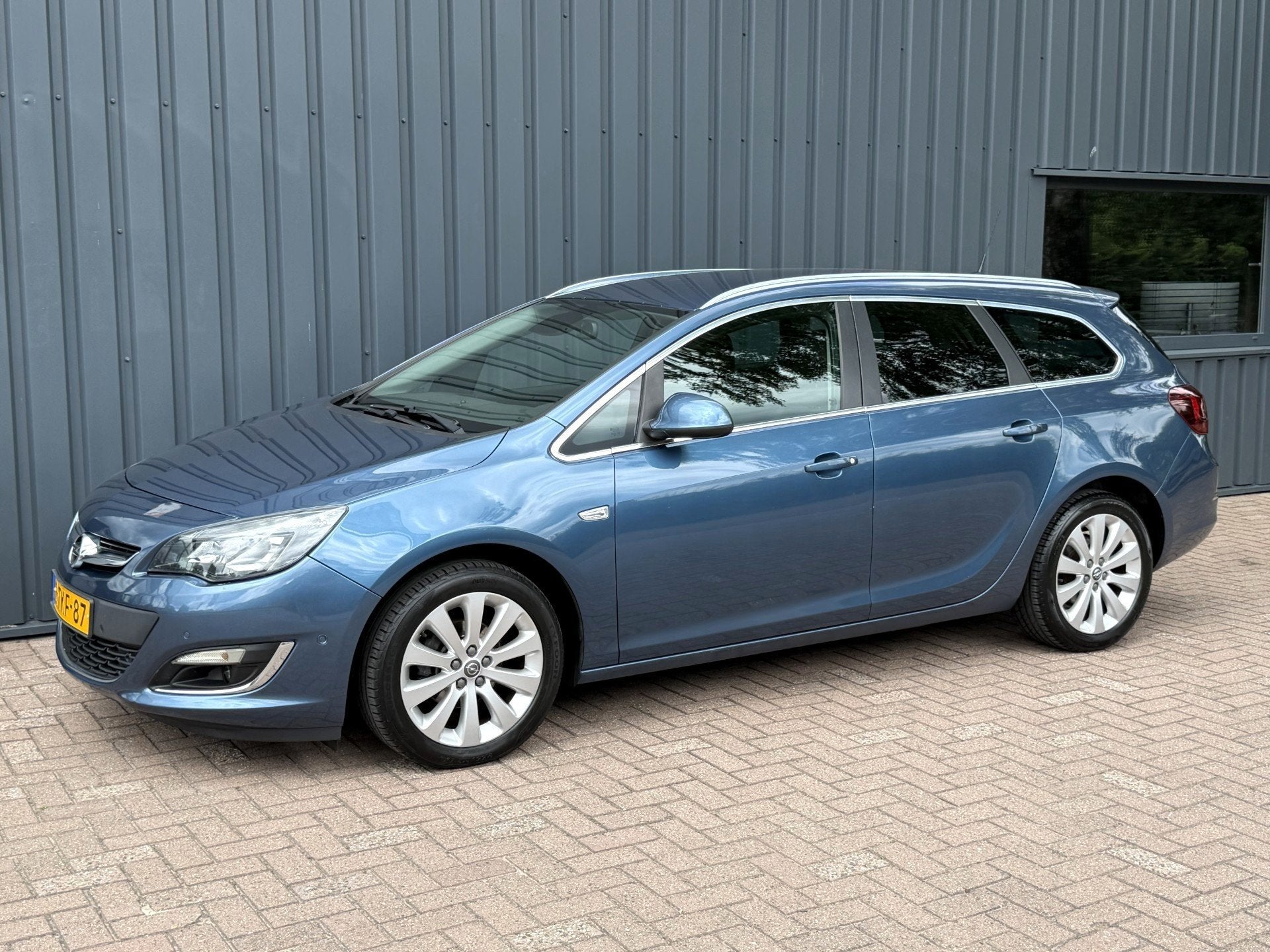 Opel Astra Sports Tourer 1.4 Turbo Cosmo AUTOMAAT!/1E EIG!/, Auto's, Euro 5, 15 km/l, Gebruikt, Zwart