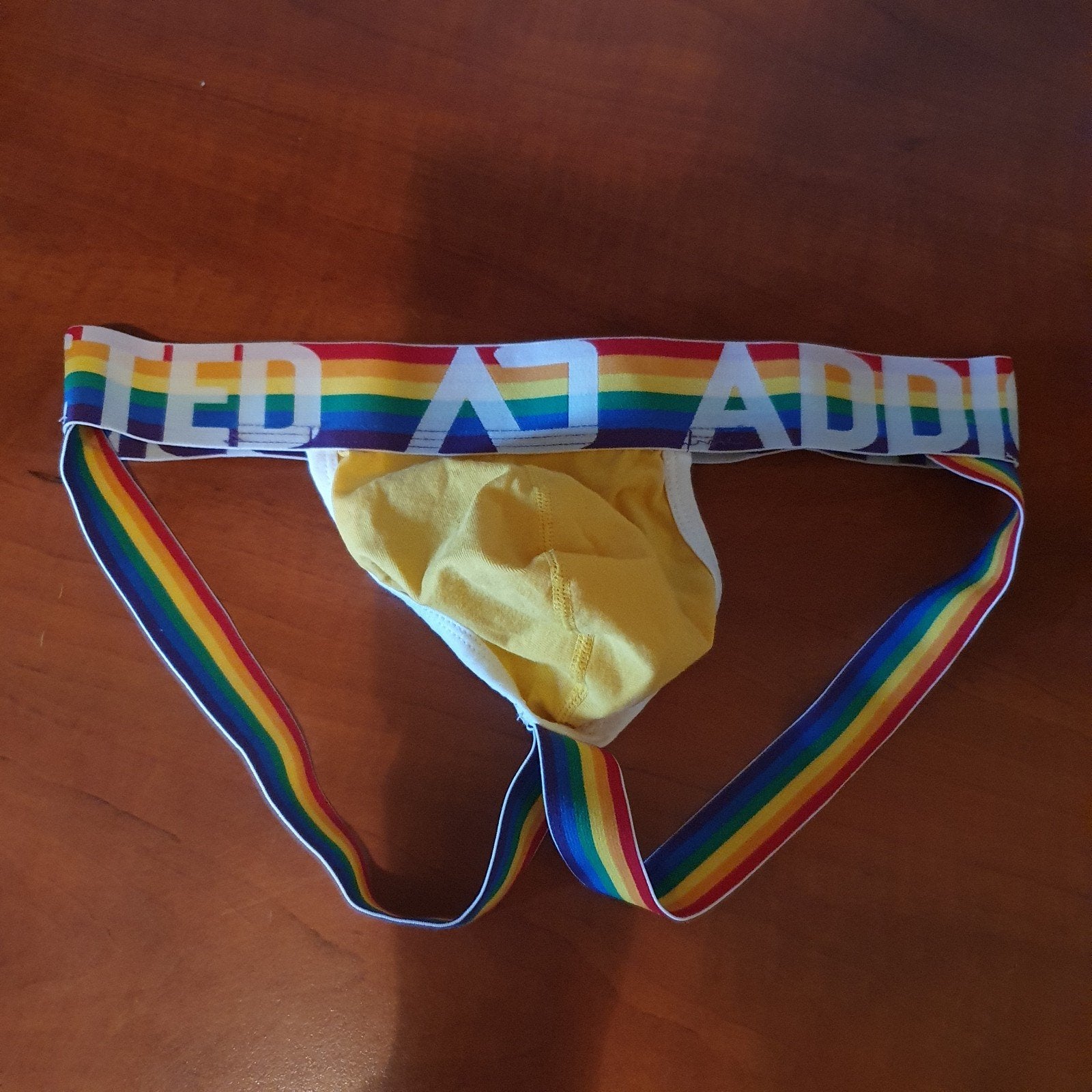 Addicted Jockstrap Geel met Regenboogband - Maat M, Ophalen of Verzenden, Geel, Addicted, Overige typen