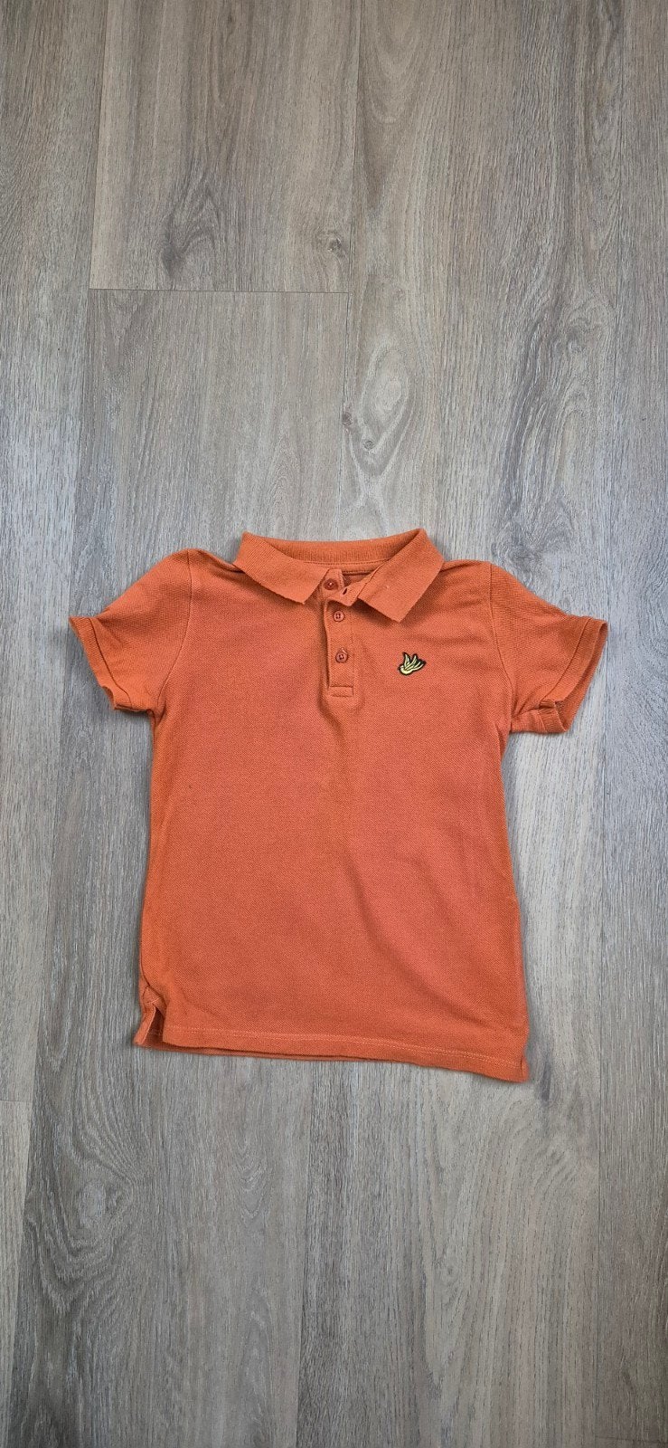 Oranje polo, WE, maat 98/104, Kinderen en Baby's, Kinderkleding | Maat 98, WE, Ophalen of Verzenden, Zo goed als nieuw, Shirt of Longsleeve