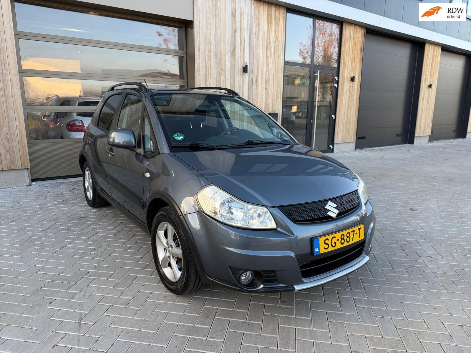 Suzuki SX4 1.6 Comfort 5drs|Airco|Stoelverwarming|Trekhaak|N, Gebruikt, Zwart, 4 cilinders, Handgeschakeld