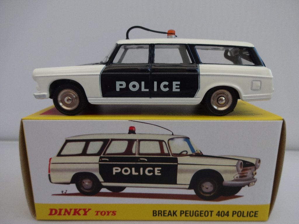 Peugeot 404 Break Police nr: 1429 van Dinky Toys 1:43, Hobby en Vrije tijd, Ophalen of Verzenden, Nieuw, Auto, Dinky Toys
