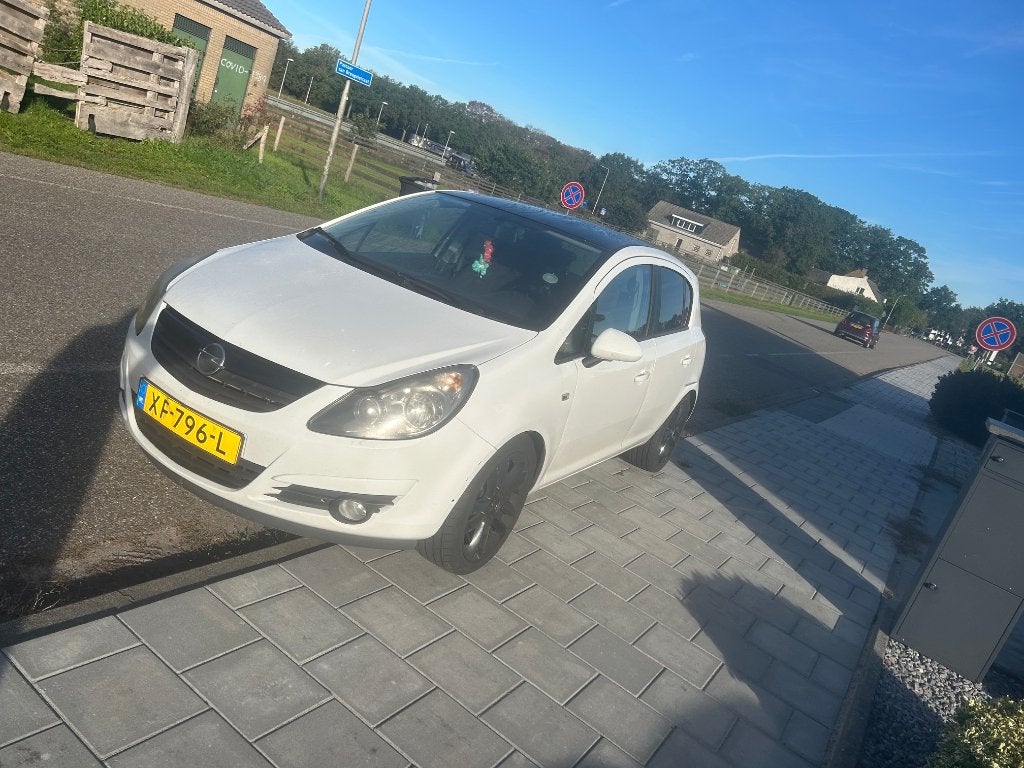 Opel Corsa  2011 Wit, Auto's, Stof, Centrale vergrendeling, 1229 cc, Handgeschakeld