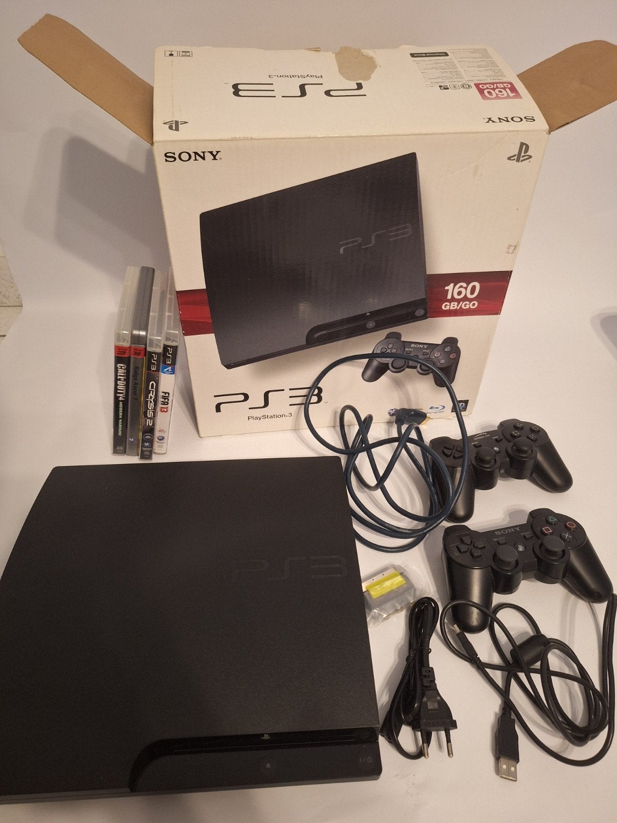 PS3 met doos, alle kabels en 4 games, Ophalen of Verzenden, Gebruikt, Met 1 controller, Slim