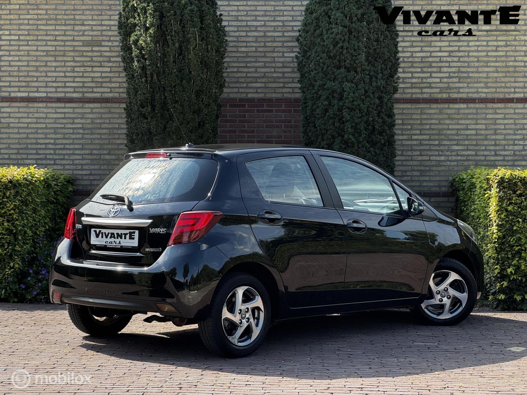 Toyota Yaris 1.5 Hybrid Trend Bi-Tone Camera*Cruise*Navi*Cli, Auto's, Gebruikt, Euro 6, Met garantie (alle), Origineel Nederlands