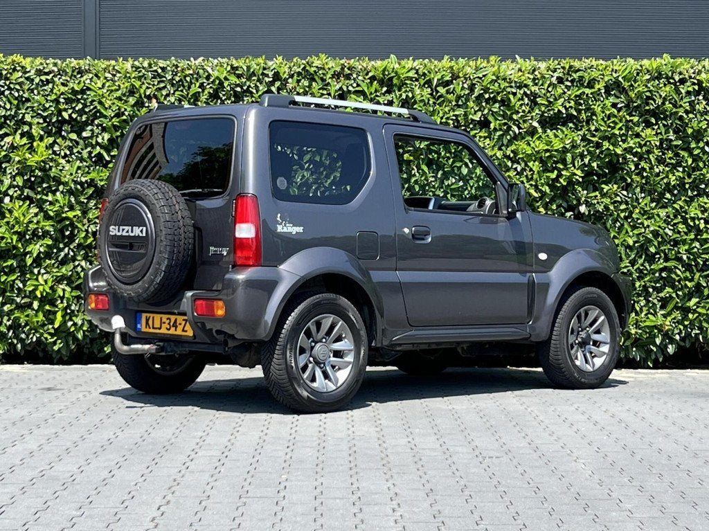 Suzuki Jimny 1.3 Exclusive RANGER, LEDER, AIRCO, STOELVERWAR, Auto's, Suzuki, 86 pk, Gebruikt, Zwart, 4 stoelen